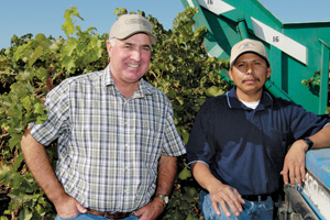 San Joaquin county farmer Joe Valente, left, values the contributions of the many long-term employees at Kautz Farms. Robert Camargo, right, started 20 years ago as a field laborer and now works as head mechanic.