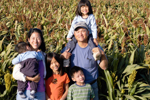 Despite being squeezed by urban growth, Felicia and Derrick Lum hope to pass the family farm to their children.